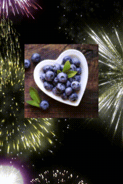 Heart Shaped Bowl Of Blueberries With Fireworks GIF