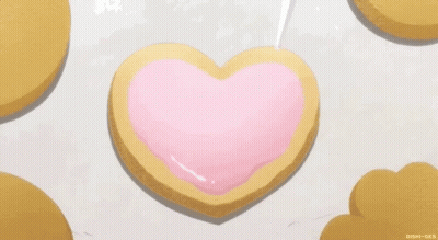 Heart Shaped Cookie With Pink Icing GIF