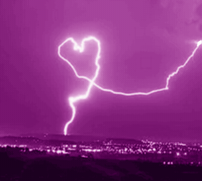 Heart-Shaped Lightning Bolt In Purple Sky Over City GIF