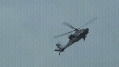 Helicopter Flying Through Cloudy Sky