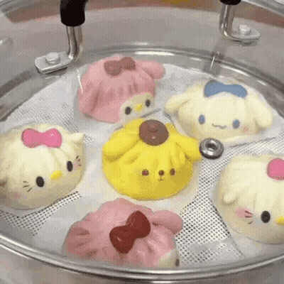 Hello Kitty And Pompompurin Dumplings In Steamer GIF