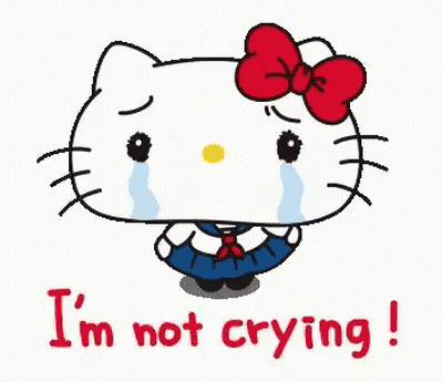 Hello Kitty Is Crying With Tears Running Down Her Face And The Words `` I 'M Not Crying '' Below Her . GIF