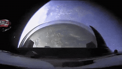 Helmet In Space With Rocket GIF