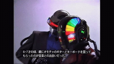 Helmeted Men Talking, One In Suit GIF