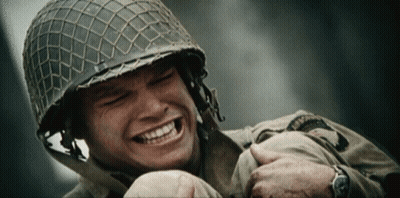 Helmeted Soldier Smiling Holding Another Soldier's Arm GIF