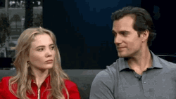 Henry Cavill And Freya Allan Eyes Meet Smile GIF
