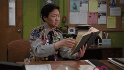 Hidetoshi Hasagawa Smiling Reading Book  GIF