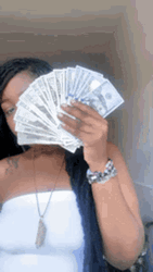 Hiding Face Behind Money Bags GIF