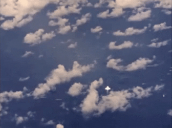 High-Altitude Bomb Explosion Amidst Clouds GIF