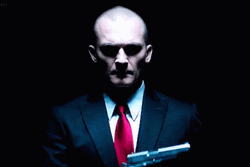 Hitman Fixing His Glove GIF