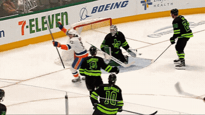 Hockey Game In Front Of 7-Eleven And Boeing Ads GIF