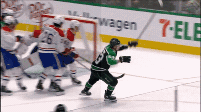 Hockey Game In Front Of 7 Eleven Banner GIF