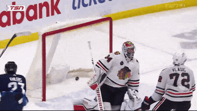 Hockey Game In Front Of Abank Banner GIF