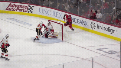 Hockey Game In Front Of Advance Auto Parts Banner GIF