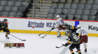 Hockey Game In Front Of Altitude 92.5 Banner GIF