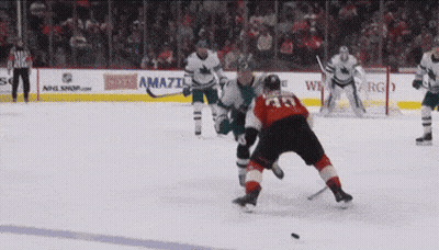 Hockey Game In Front Of Amazi Ad GIF