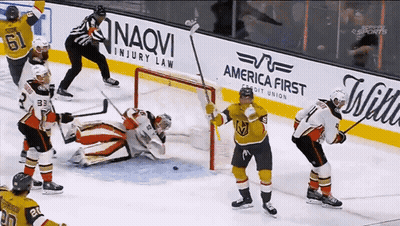 Hockey Game In Front Of America First Credit Union Ad GIF