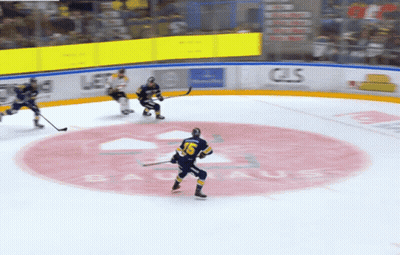 Hockey Game In Front Of Bauhaus Sign GIF