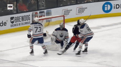 Hockey Game In Front Of Brewdog Banner GIF