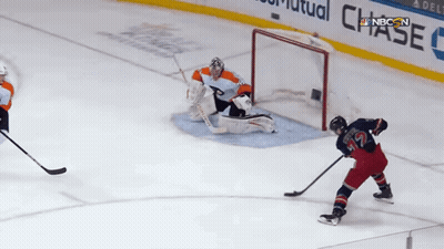 Hockey Game In Front Of Chase Sign GIF