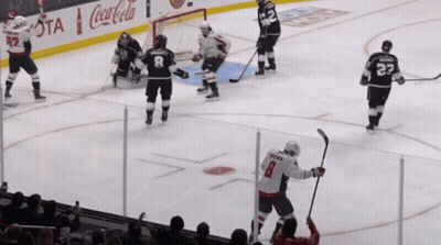 Hockey Game In Front Of Coca Cola Advertisements GIF