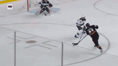 Hockey Game In Front Of Coca Cola Sign GIF
