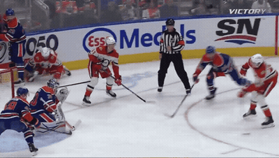 Hockey Game In Front Of Cox Ad GIF