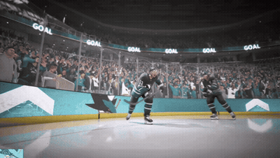 Hockey Game In Front Of Crowd With Scoreboard GIF