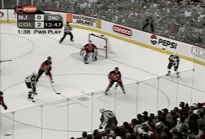 Hockey Game in Front of Crowd