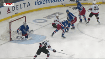 Hockey Game In Front Of Delta Ticketmaster Sign GIF