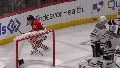 Hockey Game In Front Of Endeavor Health Sign GIF