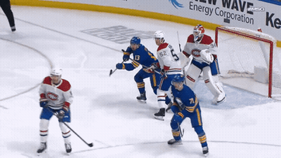 Hockey Game In Front Of Energy Ad GIF