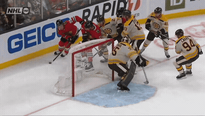 Hockey Game In Front Of Geico Ad GIF