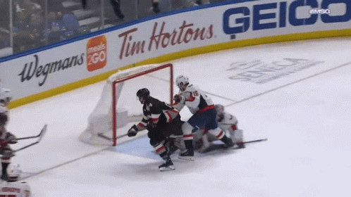Hockey Game In Front Of Geico And Tim Hortons GIF