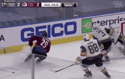 Hockey Game In Front Of Geico Sign GIF