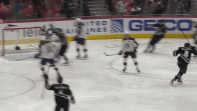 Hockey Game In Front Of Geico Sign GIF