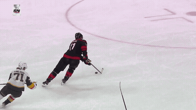 Hockey Game In Front Of Geico Sign GIF