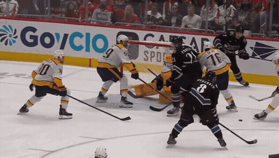 Hockey Game In Front Of Govcio Sign GIF