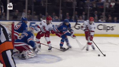 Hockey Game In Front Of GPS Ad GIF