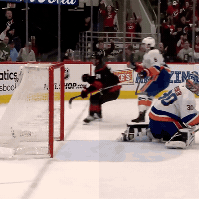 Hockey Game In Front Of Hop.com Banner GIF