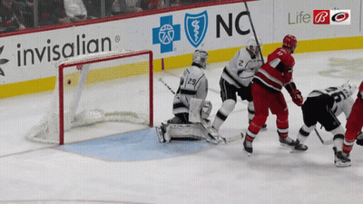 Hockey Game In Front Of Invisalign Sign GIF