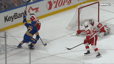 Hockey Game In Front Of KeyBank Sign GIF