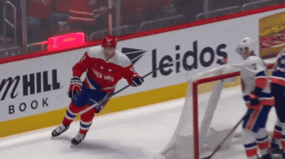 Hockey Game In Front Of Leidos Ad GIF