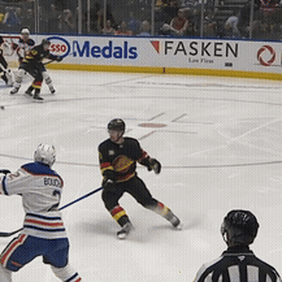 Hockey Game In Front Of Medals Banner GIF