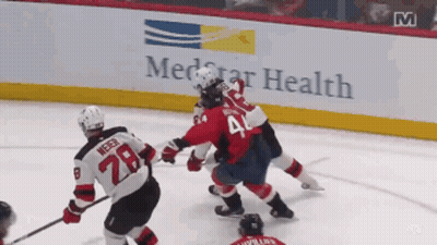Hockey Game In Front Of MedStar Health Ad GIF