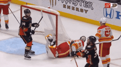 Hockey Game In Front Of Monster Energy Banner GIF