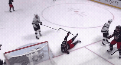 Hockey Game In Front Of NetJets Sign GIF