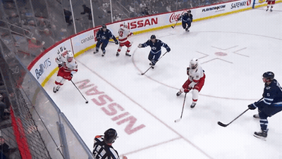 Hockey Game In Front Of Nissan Sign GIF