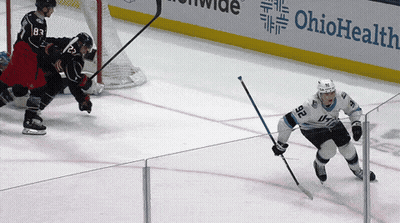 Hockey Game In Front Of Ohio Health Ad GIF