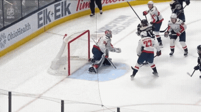 Hockey Game In Front Of Ohio Health Banner GIF